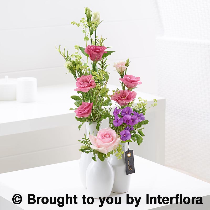 three vases of flowers