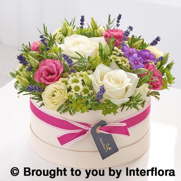 hatbox arrangement of summer flowers